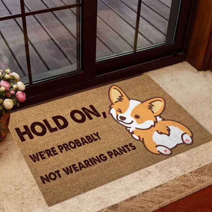 Hold On Were Probably Not Wearing Pants Corgi Easy Clean Welcome DoorMat